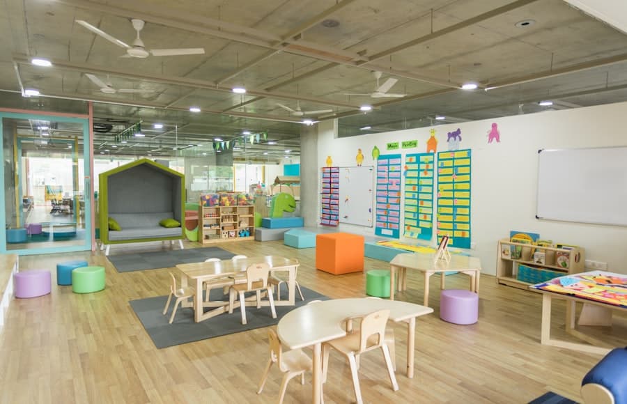 A bright preschool classroom with small tables and chairs.